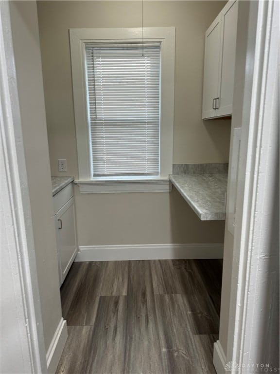 unfurnished dining area featuring dark hardwood / wood-style floors