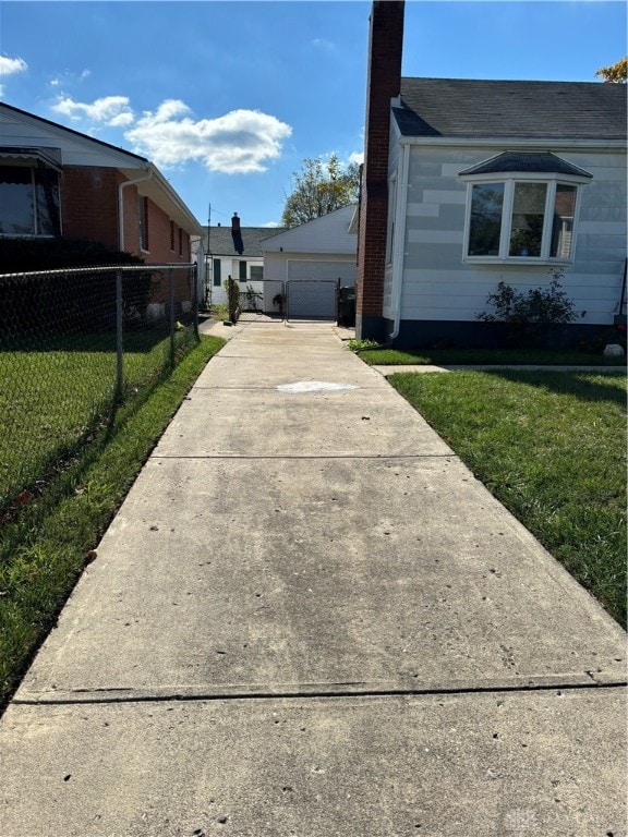 view of side of home with a yard