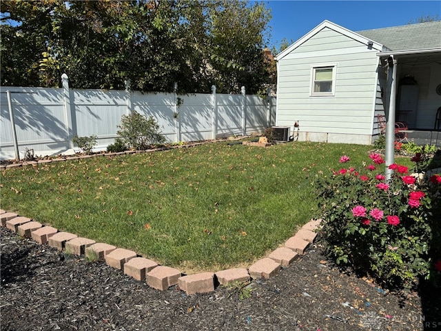 view of yard featuring central AC unit