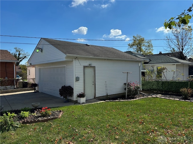 garage featuring a lawn