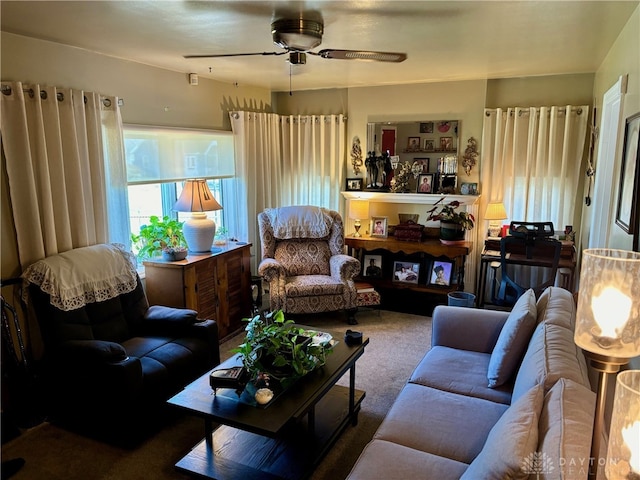 carpeted living room with ceiling fan