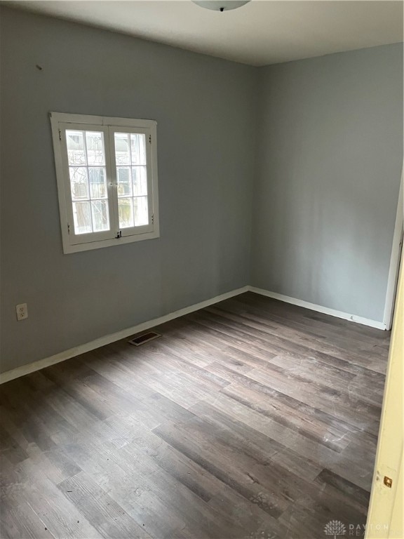 spare room featuring hardwood / wood-style floors