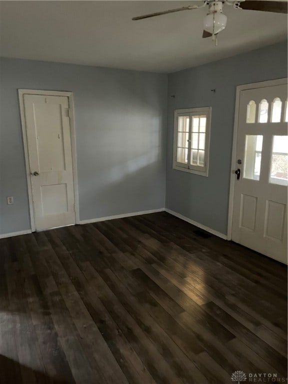 foyer entrance featuring ceiling fan and dark hardwood / wood-style flooring