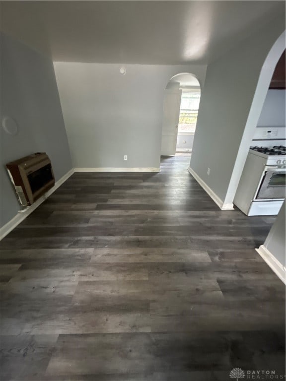 unfurnished room with dark hardwood / wood-style flooring