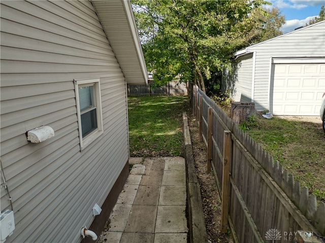 view of side of home with a lawn