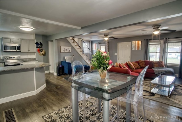 dining room featuring dark hardwood / wood-style flooring and ceiling fan