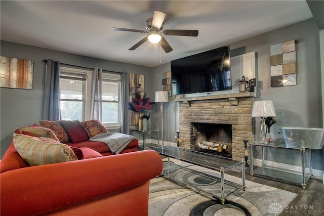 living room with a fireplace, hardwood / wood-style floors, and ceiling fan