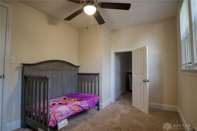 carpeted bedroom featuring ceiling fan