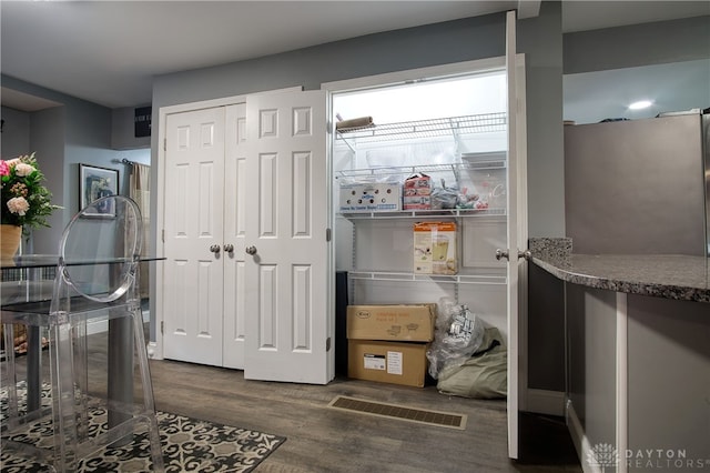 interior space with dark hardwood / wood-style flooring