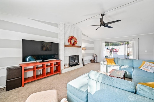 carpeted living room with ceiling fan, lofted ceiling, and a fireplace