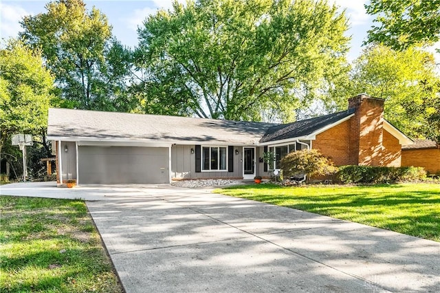 ranch-style house featuring a garage and a front yard