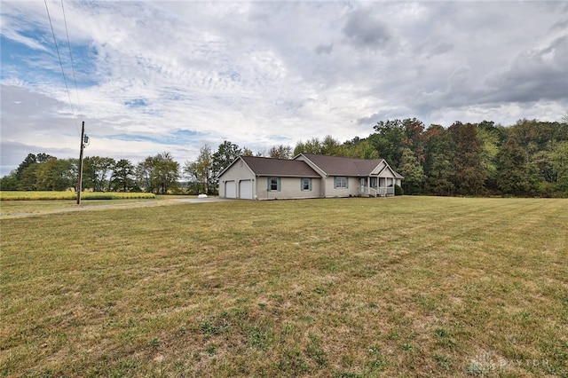 view of front of property featuring a garage and a front yard