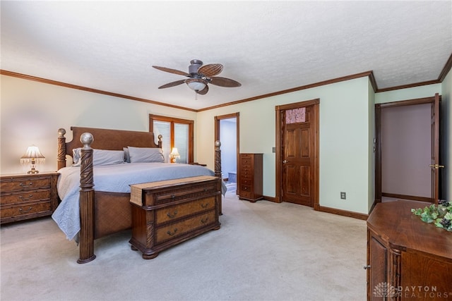 carpeted bedroom with crown molding, ceiling fan, ensuite bath, and a textured ceiling