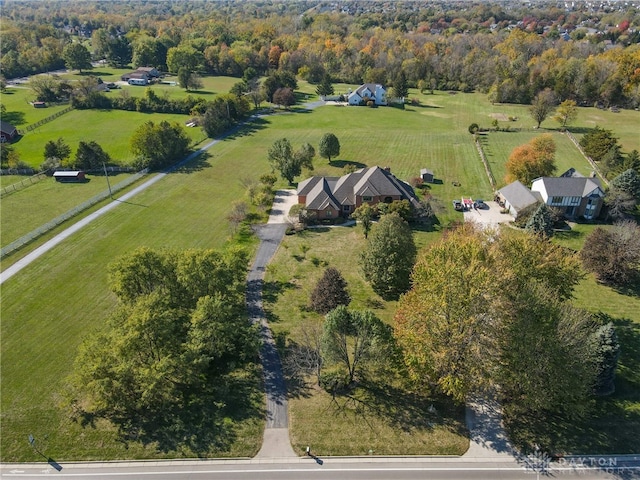 birds eye view of property with a rural view