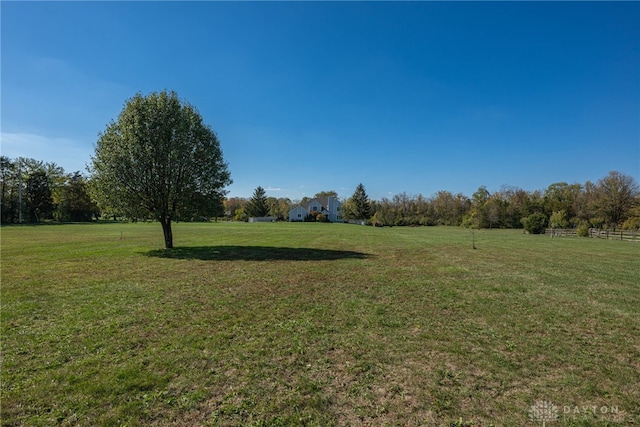 view of yard with a rural view