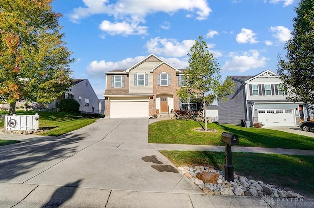 traditional-style home featuring brick siding, driveway, a front yard, and a garage