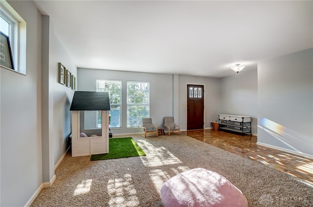 unfurnished living room featuring carpet