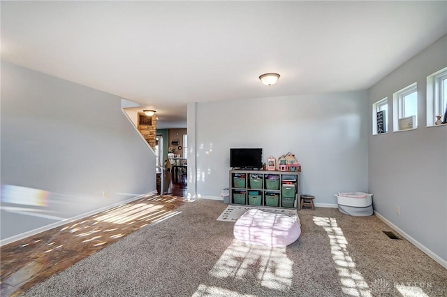 game room with visible vents, baseboards, and carpet floors