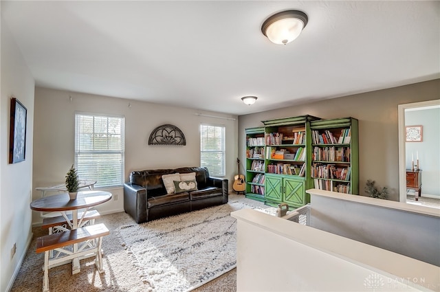 living area featuring a healthy amount of sunlight and carpet floors