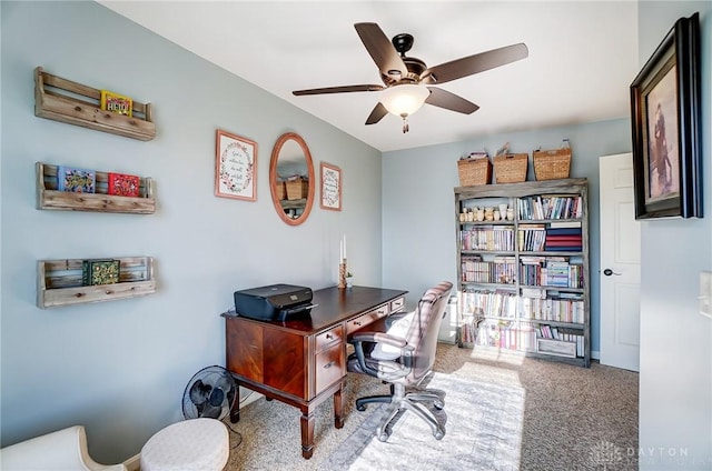 office with carpet flooring and a ceiling fan