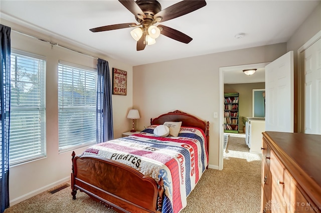 carpeted bedroom featuring ceiling fan