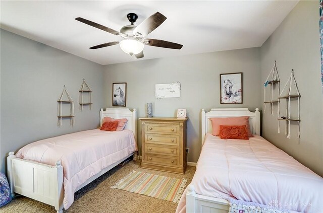 carpeted bedroom featuring ceiling fan