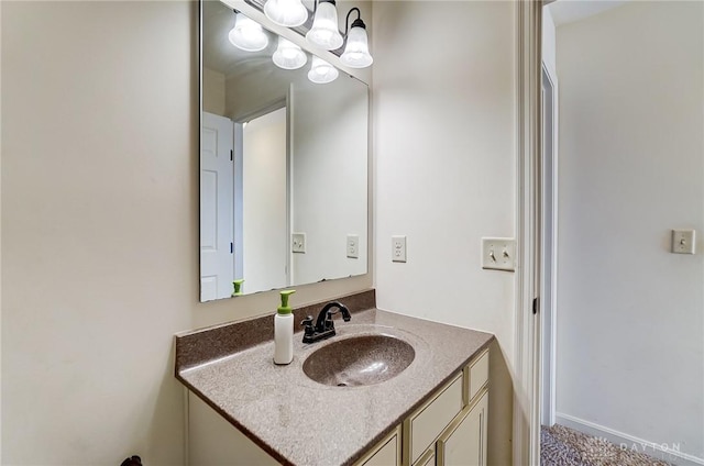 bathroom with vanity and an inviting chandelier