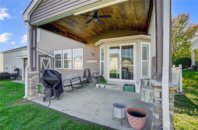 view of patio / terrace featuring a grill and a ceiling fan