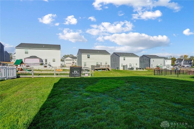 view of yard featuring a residential view and fence