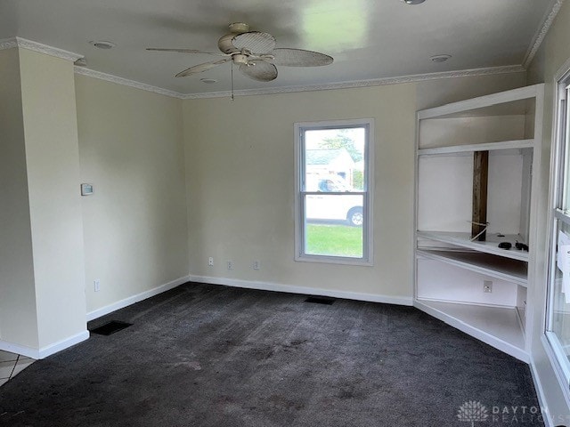 carpeted empty room with crown molding and ceiling fan