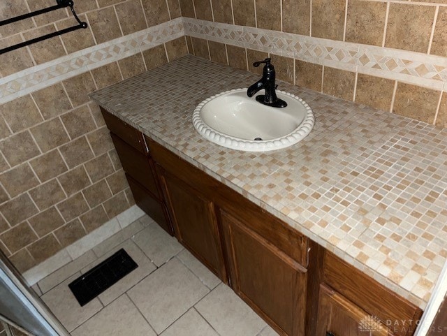 bathroom with vanity and tile patterned floors