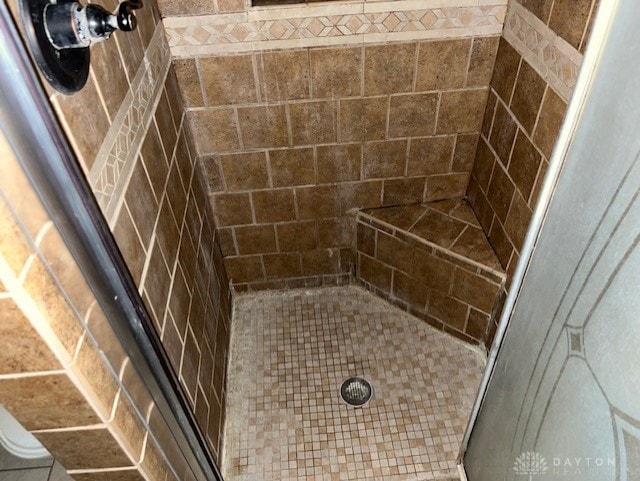 bathroom featuring an enclosed shower