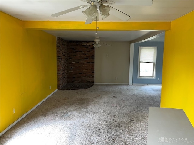 interior space with ceiling fan and carpet floors