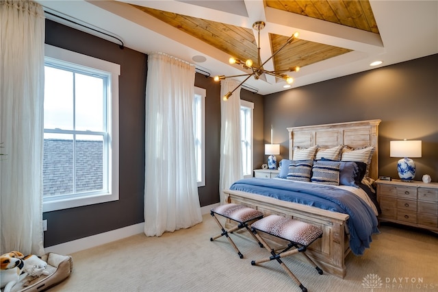 carpeted bedroom with a notable chandelier and wooden ceiling