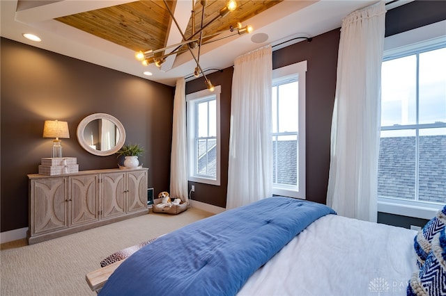 carpeted bedroom featuring vaulted ceiling, wooden ceiling, multiple windows, and an inviting chandelier