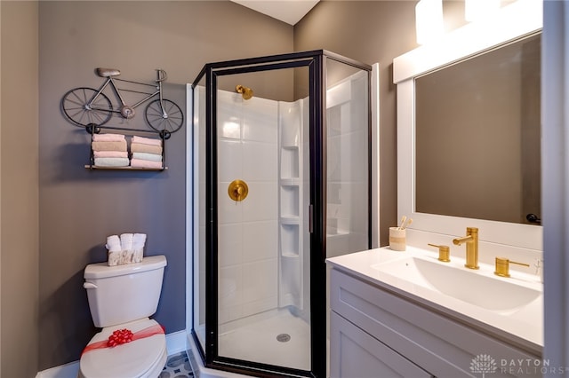 bathroom with a shower with door, toilet, and vanity