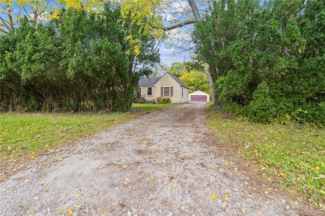 view of front of house with an outdoor structure