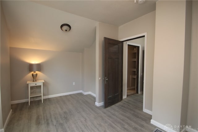 unfurnished room with hardwood / wood-style floors