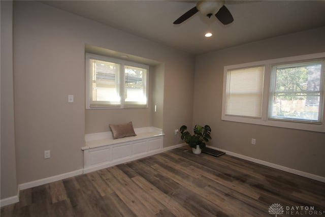 spare room featuring dark hardwood / wood-style floors and ceiling fan