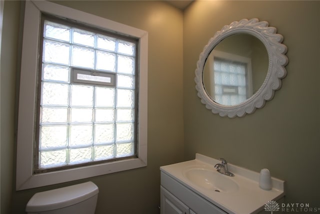 bathroom with toilet and vanity