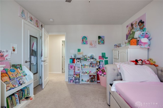 bedroom with light colored carpet