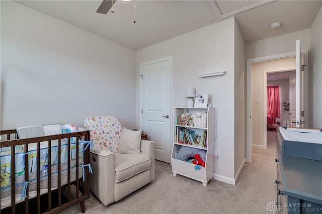 bedroom with baseboards, light colored carpet, and a ceiling fan