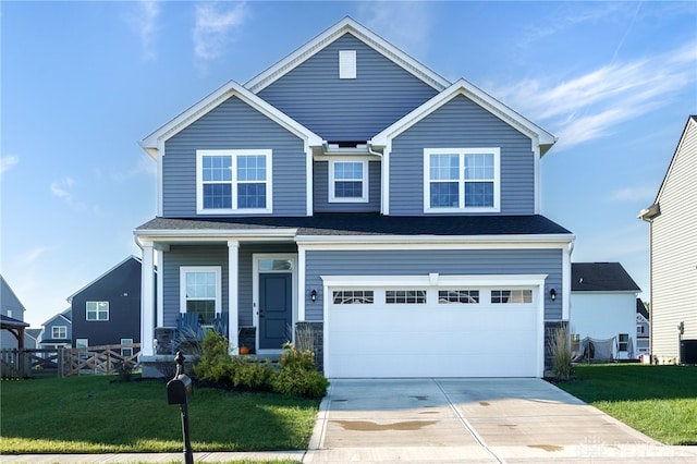 view of front facade featuring a garage and a front lawn