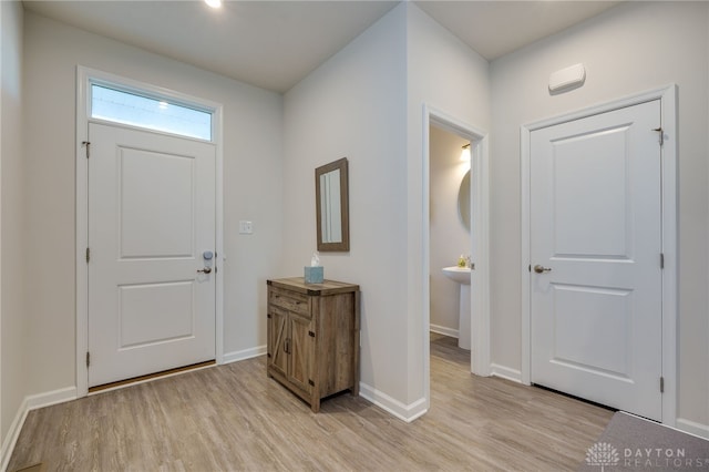 entryway with light hardwood / wood-style flooring