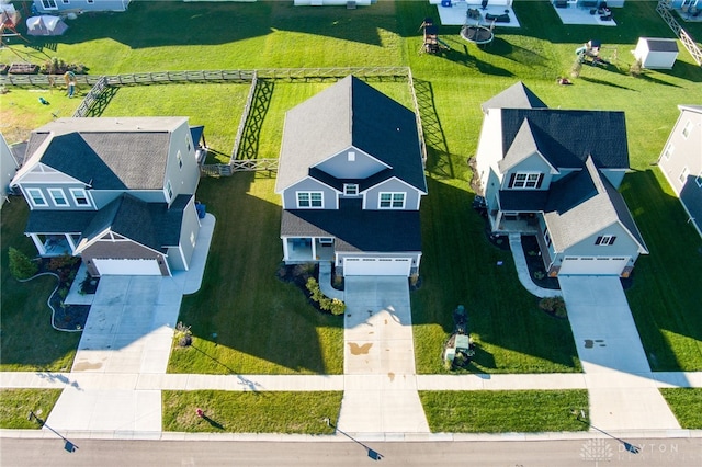 birds eye view of property with a residential view