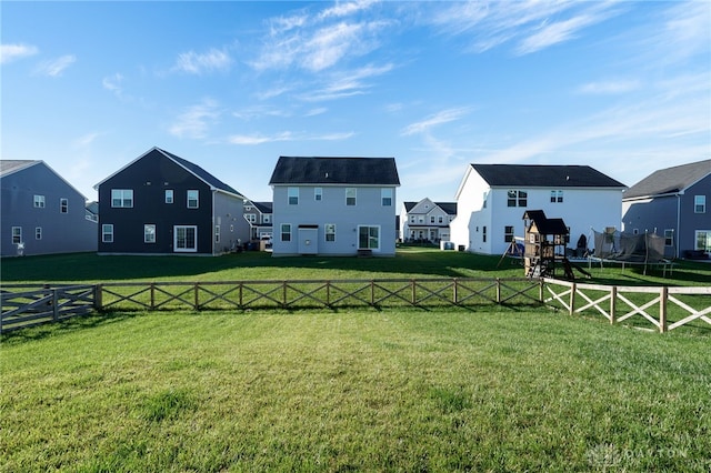 view of yard with fence and a residential view