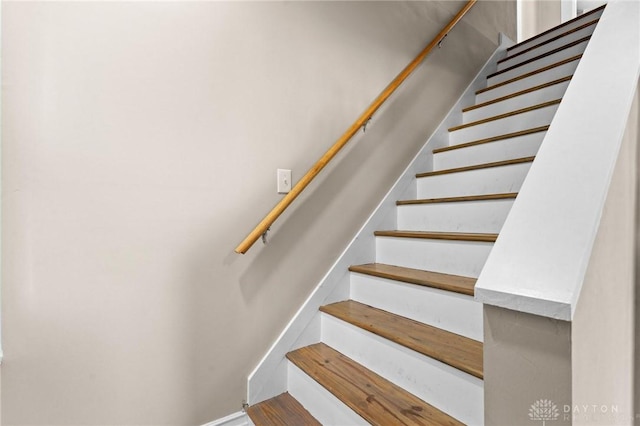 stairway with wood-type flooring