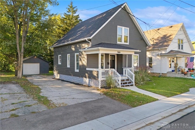 view of front facade featuring covered porch, a garage, an outdoor structure, and a front lawn