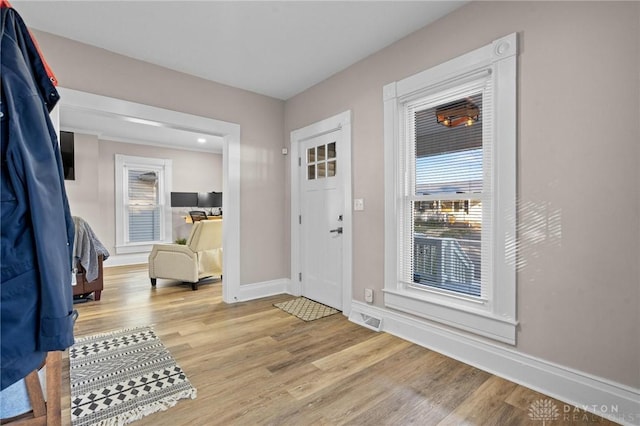 foyer entrance with light wood-type flooring