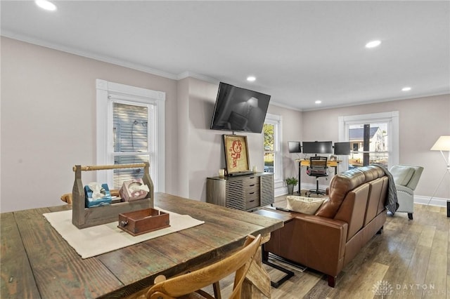 living room featuring hardwood / wood-style flooring and crown molding